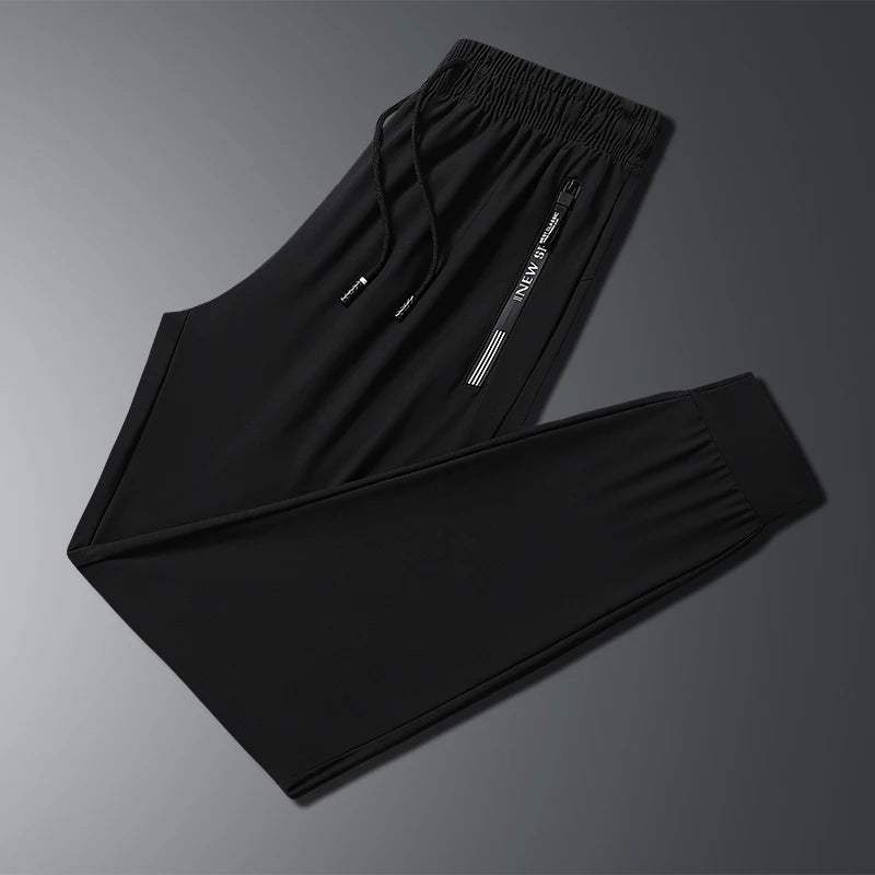 New Summer Korean Ice Silk Elastic Trousers Cool Thin Casual Men'S Loose Long Large Size Small Foot Sports Pants 8XL