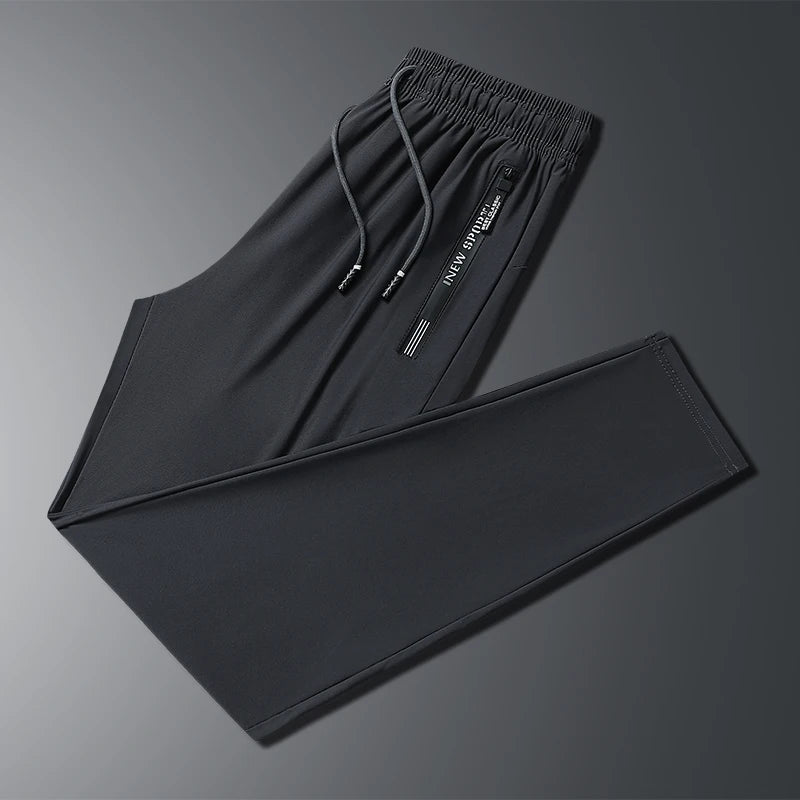 New Summer Korean Ice Silk Elastic Trousers Cool Thin Casual Men'S Loose Long Large Size Small Foot Sports Pants 8XL