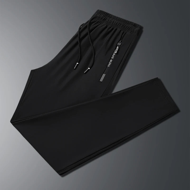 New Summer Korean Ice Silk Elastic Trousers Cool Thin Casual Men'S Loose Long Large Size Small Foot Sports Pants 8XL